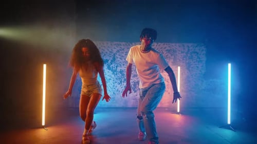 Energetic Dancing with Light Beams in Studio