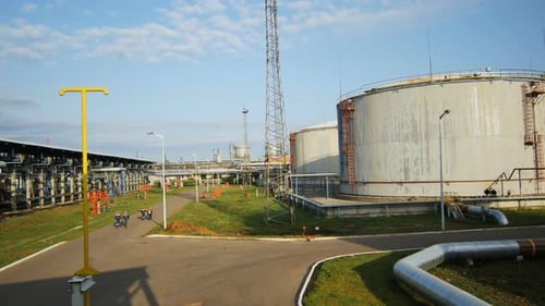Aerial View Workers Walk Among Gas and Oil Refinery Plant