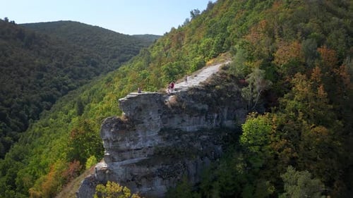 Hikers on the rock. Group of hikers stand on top of the rock ( Camel Rock) and enjoy the view. Zhigu