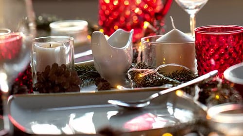 Holiday Dinner Table Setting with Decorations and Candles