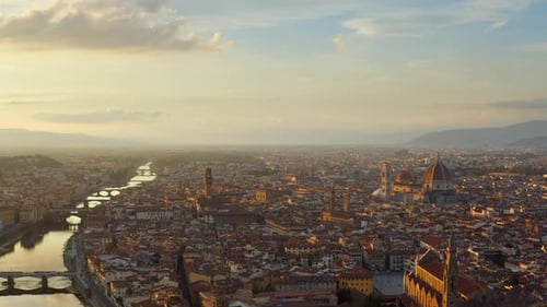 Florence, Tuscany, Italy, October 2021. Drone slowly descends towards the Arno river from a higher a