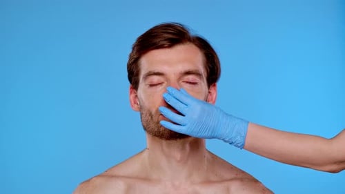 Medical Exam Prep with Man and Gloved Hand