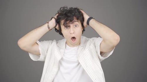Young Adult Expressing Surprise and Satisfaction
