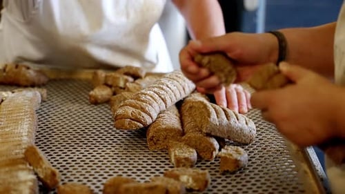 close up of hands making handmade rusks, production line of handmade pastries
