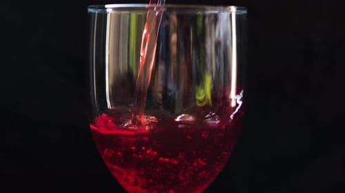 Pouring Red Wine Into a Glass