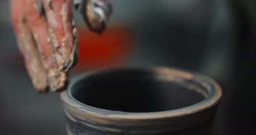 Hands Shaping Vase on Pottery Wheel Close Up