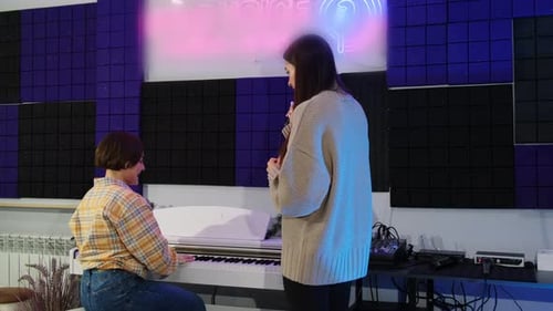 Women Collaborate, Sing and Play Piano in Studio