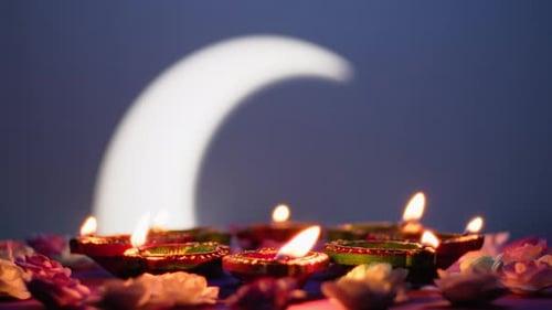 Diwali clay lamps glowing with flower decoration