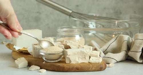 Fresh yeast being measured for baking preparation