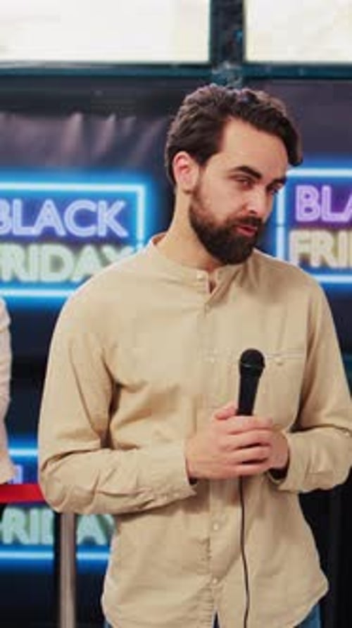Man Speaking at Black Friday Sales Event