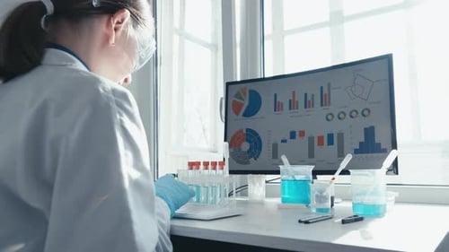 Scientist analyzing data in laboratory setting