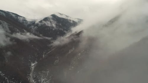 Aerial View of Snow-Dusted Mountains in Winter