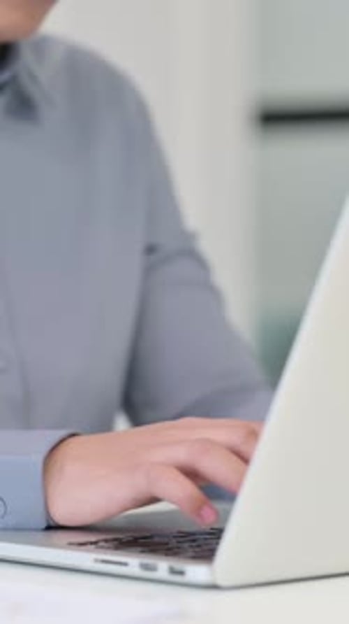 Vertical Close up of African Woman Typing on Laptop