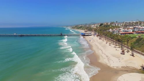 Side View Of San Clemente Pier On Pacific Coast In San Clemente, Orange County, California. aerial