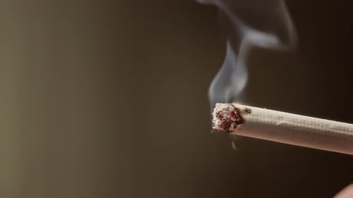smoke that comes from the burning tip of a cigarette Closeup view White Burning Cigarette Smoke Man
