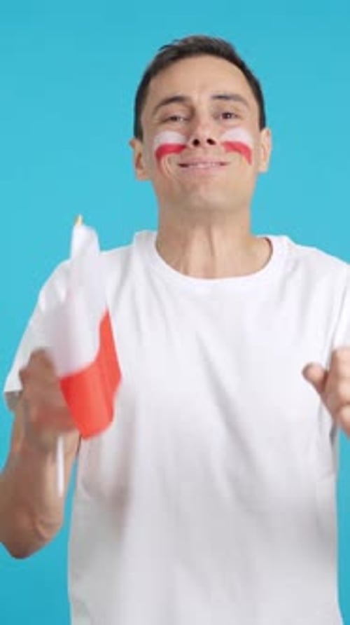 Man Cheering for Poland During a Match That is Lost