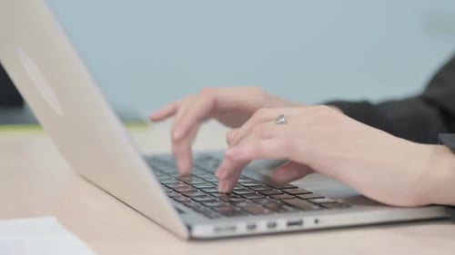Close up of Hands Typing on Laptop