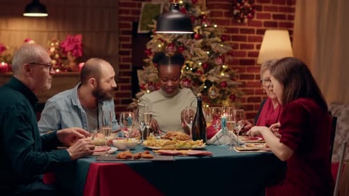 Family Dinner Around a Christmas Decorated Table