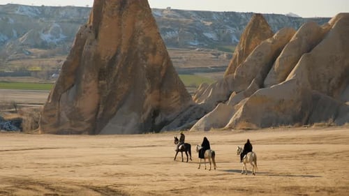 Tourists riding horses in Cappadocia