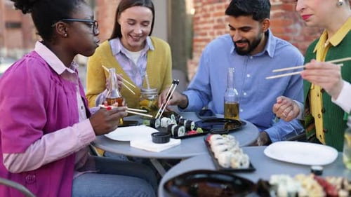 Friends Eating Sushi Outdoors