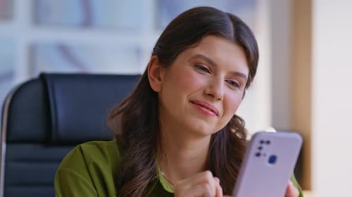 Manager Browsing Social Media on Smartphone at Work Break at Office Closeup