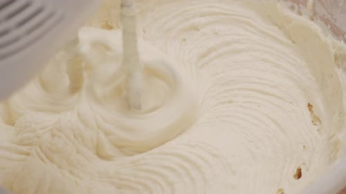 Electric Handheld Mixer Stirring Cake Ingredients Close Up, Slow Motion