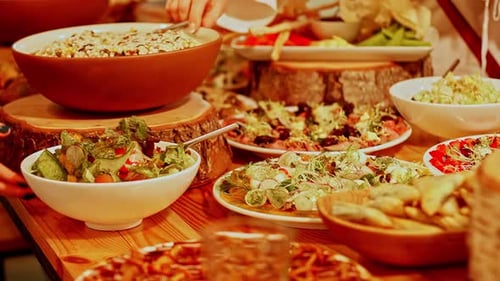 Mediterranean seafood dishes served with herbs on wooden table