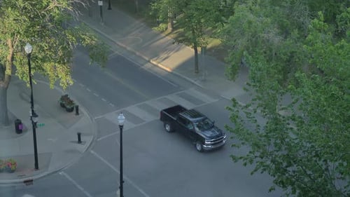 A High Shot of Traffic driving by at Street Intersection.