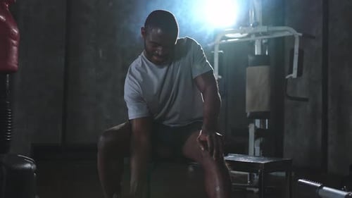 Fitness Workout in Gym African American Man Bodybuilder Picking Up Dumbbells in Gym Workout Weight