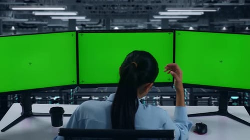 Woman Having Headache While Working With Mock Up Multiple Computer Monitor In Data Center