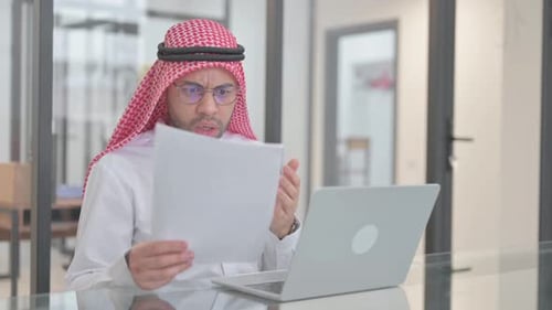 Man Working on Laptop at Office is Frustrated