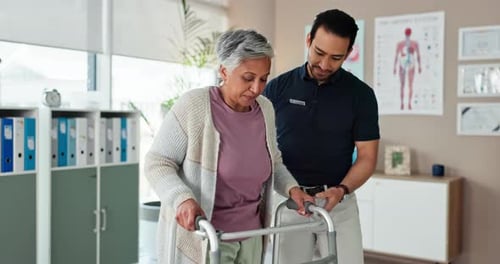 Senior Woman Uses Walker with Healthcare Professional