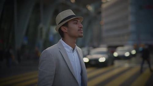 Fashionable Young Handsome Man Wearing a Hat and Casual Clothes in the City