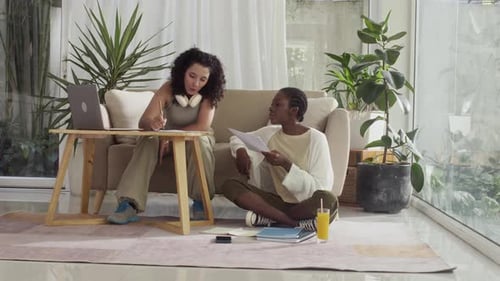 Diverse Girls Working on School Project at Home