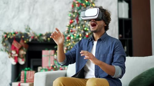 Young Adult Uses VR Headset at Christmas