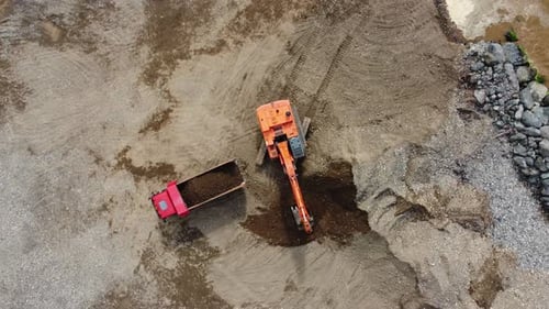 Excavator Loading Dirt in Quarry, Aerial View