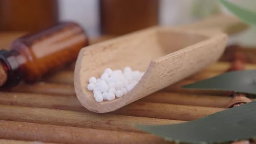Homeopathic Pills in Scoop with Tiny Bottle