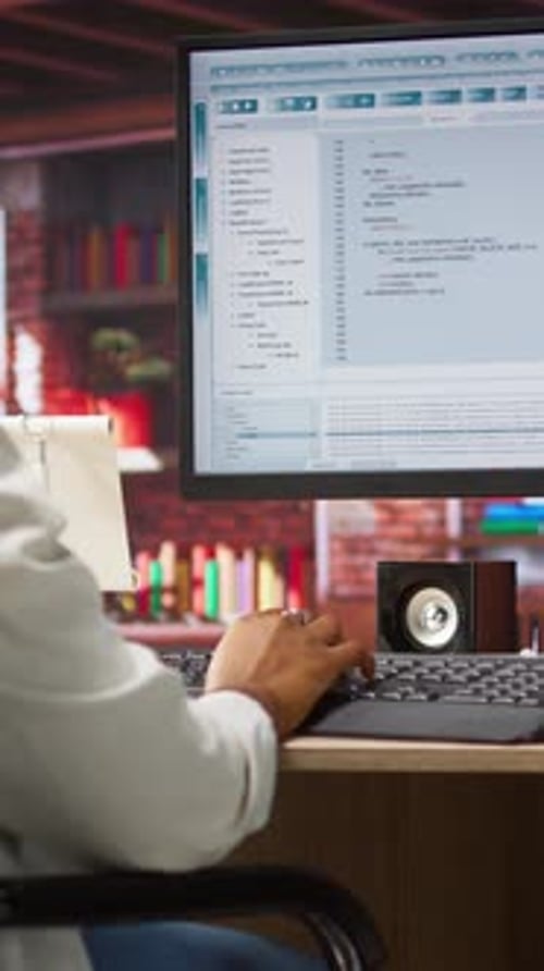 Typing at Computer Workstation in Home Office