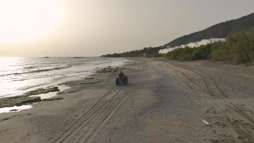 ATV Adventure Aerial View of Girl on Mediterranean Shore