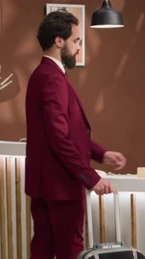 Hotel Guest Arrives and Checks in at Reception