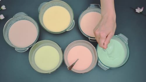Mixing Batter with Food Coloring with a Spoon