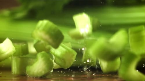 Pieces of Chopped Celery Fall on the Table Filmed on a Highspeed Camera at 1000 Fps