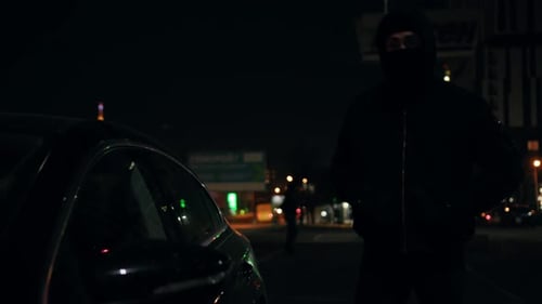 Masked Figure Trying to Break into a Car