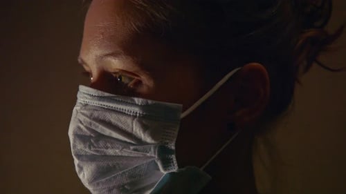 Adult Wearing Surgical Mask in Close Up