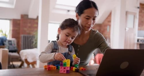 Mother and Daughter Play with Toys and Computer
