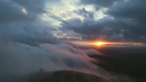 Dramatic Sunset Over Mountains With Rolling Fog