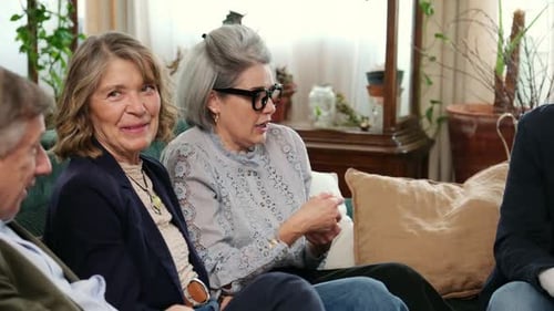 Group of Adults Talking on a Couch