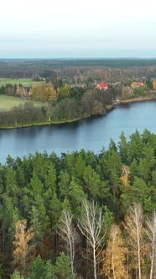 Aerial View Of Autumn Forest And Lake In Polish Countryside