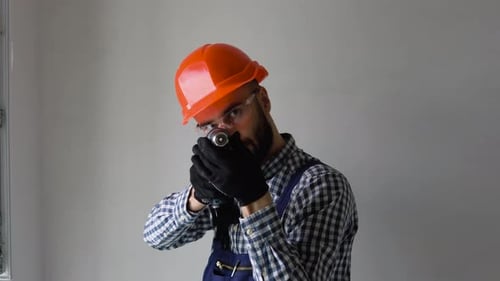 Funny Window Installer with Screwdriver Depicts Shooting During a Break