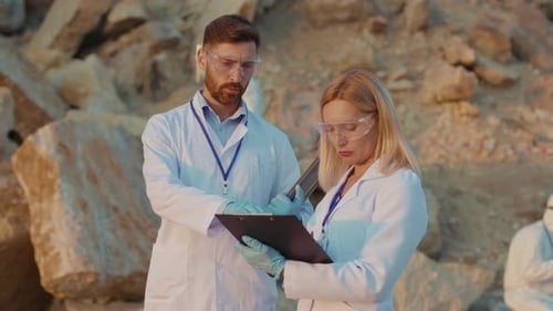 Scientists Analyze the Environment in Desert Landscape